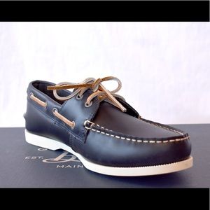 Never worn, men’s navy leather boat shoes